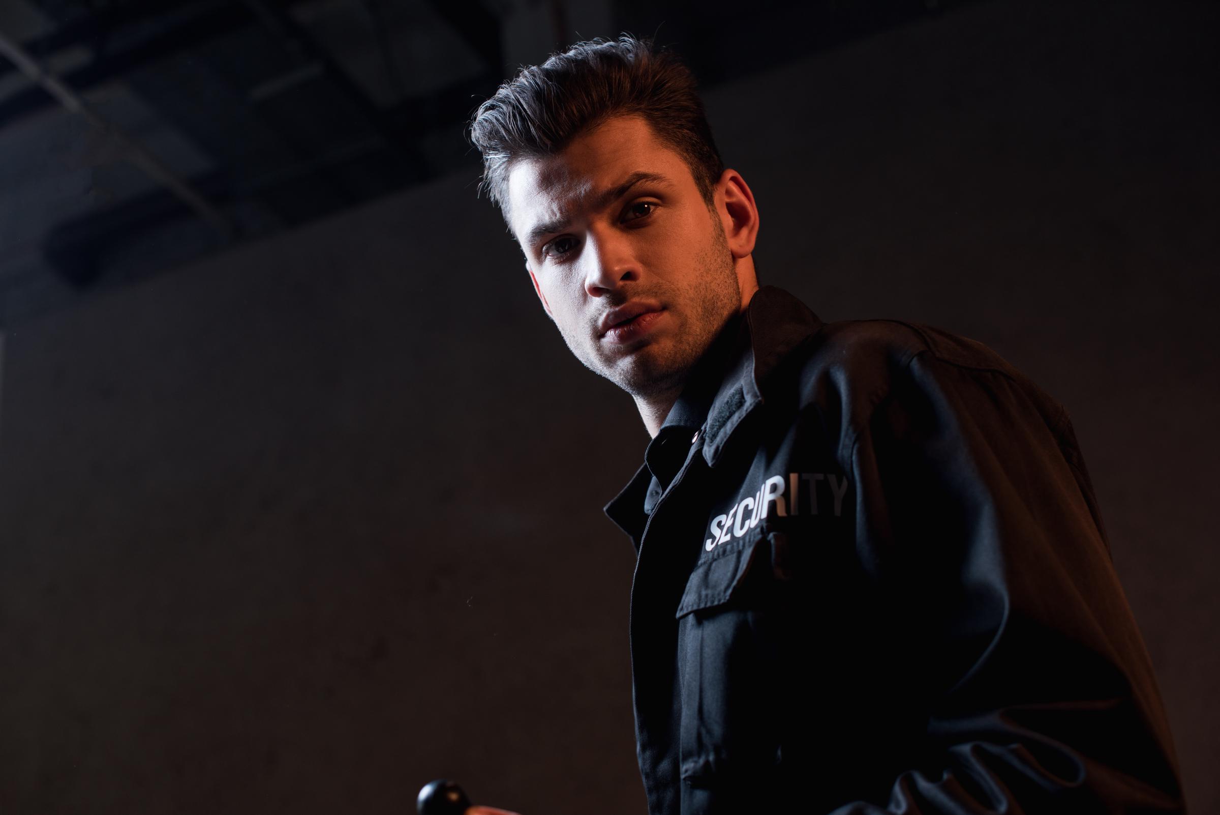 Security guard looking at someone off camera | Source: Shutterstock