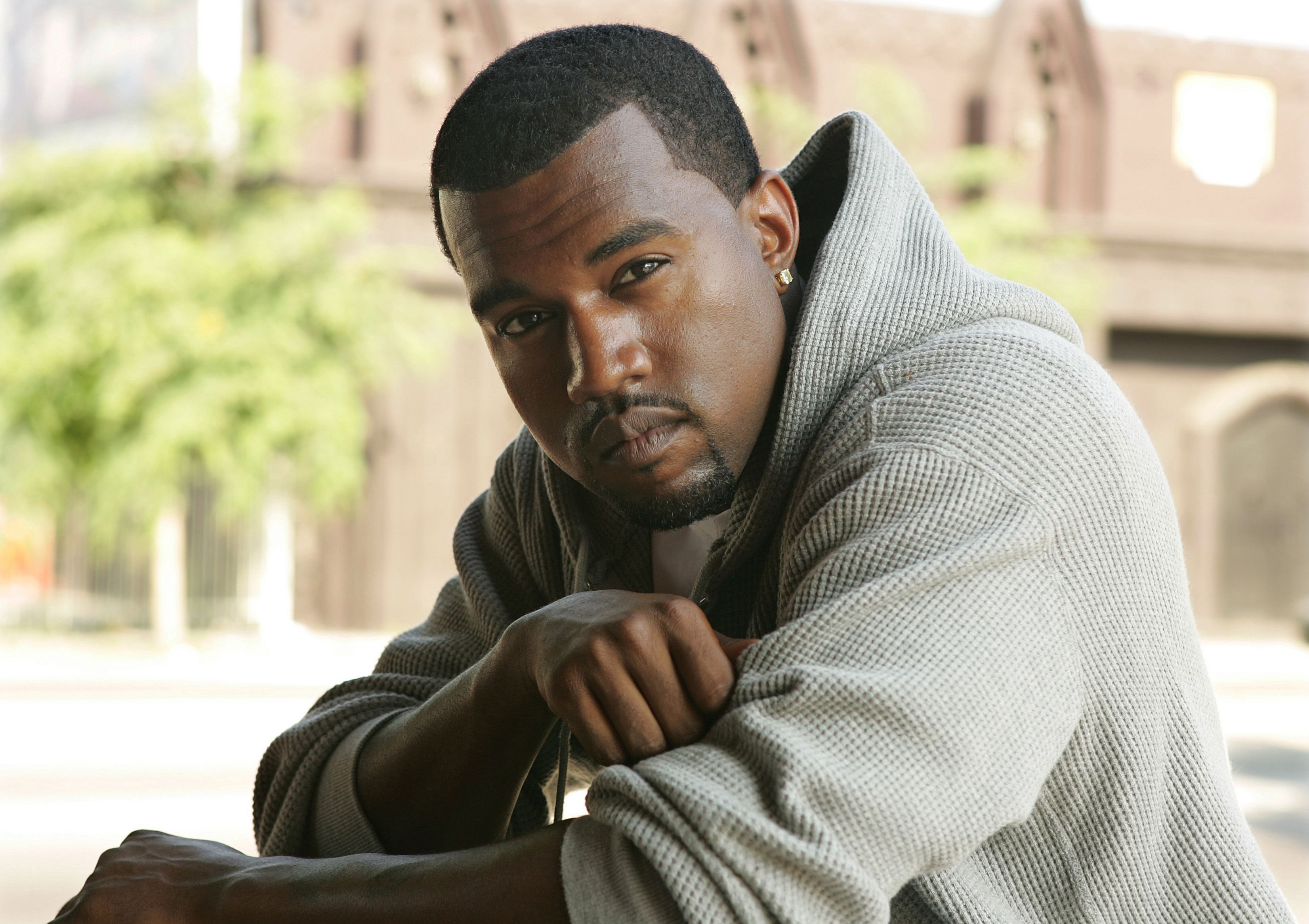 Kanye West poses for a photo outdoors, July 29, 2005 in Los Angeles, California. | Source: Getty Images