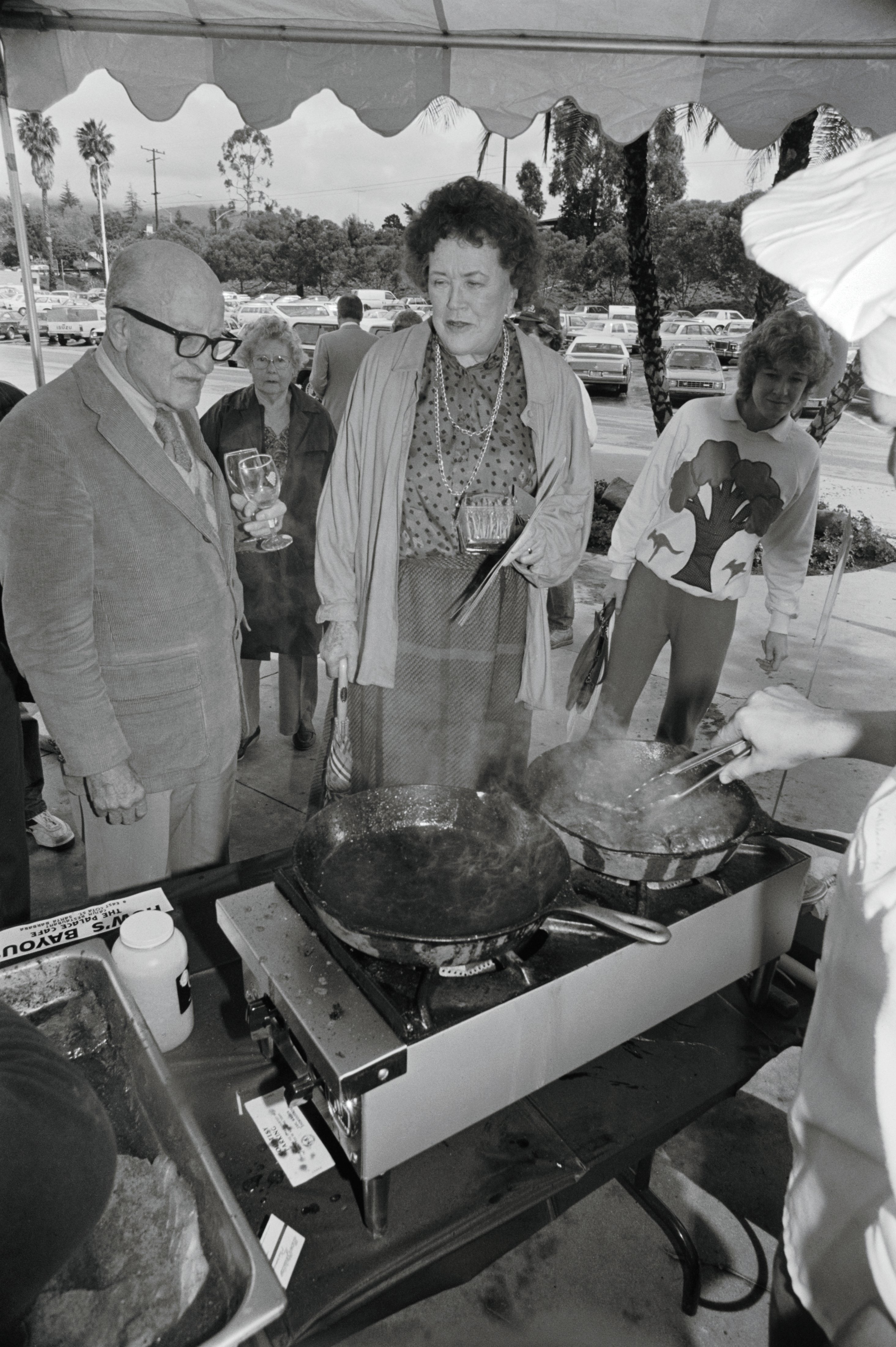 Julia Child accompanied by Paul Child, mingles at a Santa Barbara food festival in Santa Barbara, California. 
