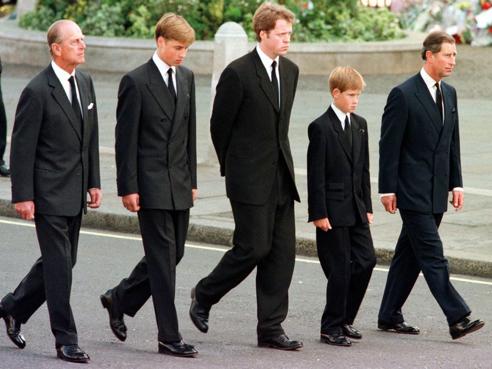 From left: Prince Philip, Prince William, Charles Spencer, Prince Harry and Prince Charles walk behind Princess Diana's casket at her September 6, 1997 funeral. | Source: Getty Images