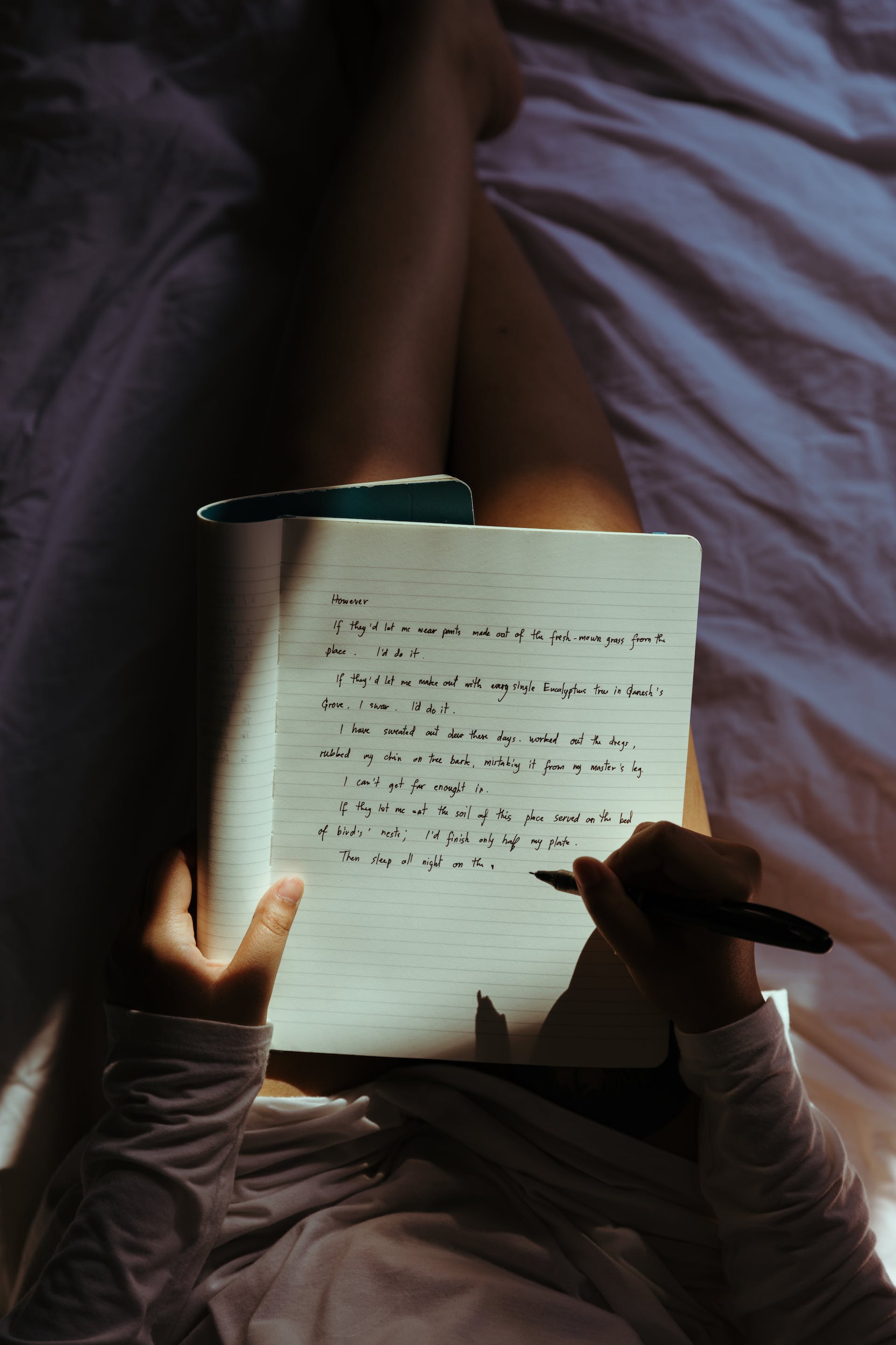 A woman writing in her diary | Source: Pexels