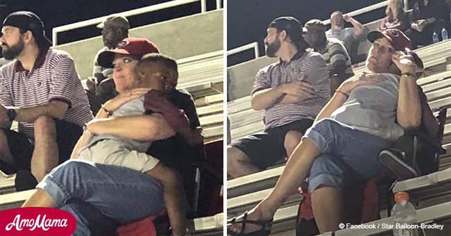 Woman hugs little boy at a football game and the picture goes viral