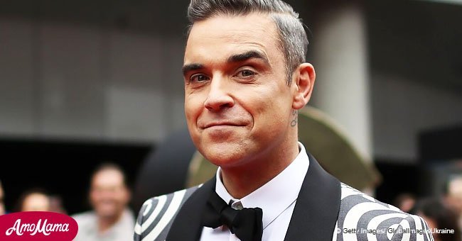 Robbie Williams sparks debates as he shows off a new bizarre tattoo situated in the middle of his chest