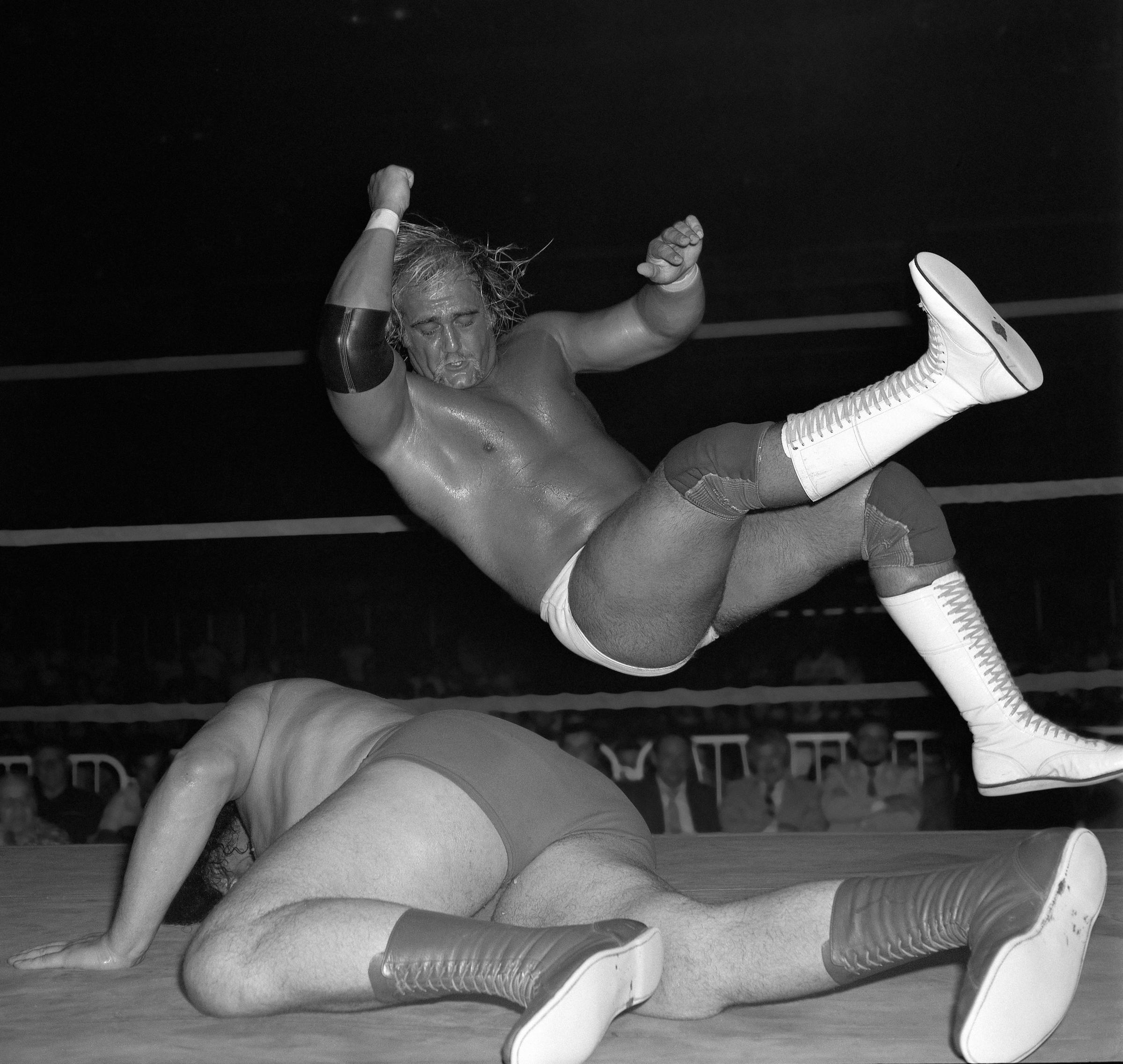 Hulk Hogan in mid air about to deliver an "elbow smash" to Andre the Giant's back during their match in Montreal, Canada on August 25, 1980 | Source: Getty Images