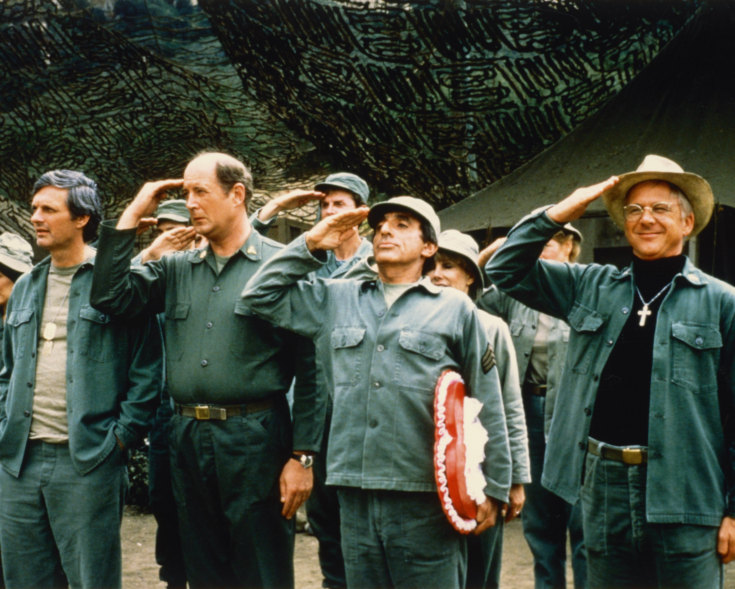 The cast saluting in a publicity still issued for the US television series 'M*A*S*H', USA, circa 1975 | Photo: Getty Images