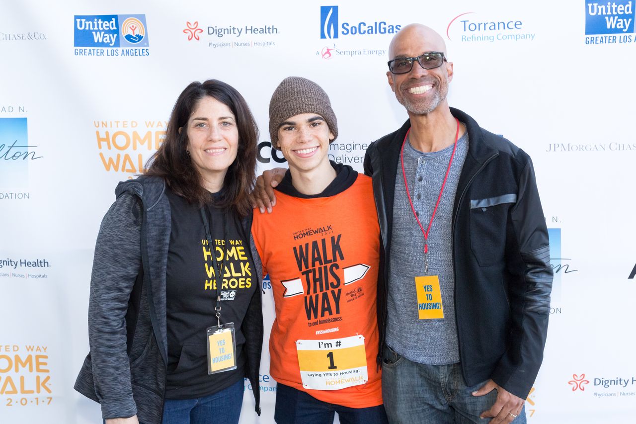 Actor Cameron Boyce, with parents Libby and Victor Boyce at the United Way 11th Annual HomeWalk To End Homelessness/ Source: Getty Images Actor Cameron Boyce, with parents Libby and Victor Boyce at the United Way 11th Annual HomeWalk To End Homelessness/ Source: Getty Images