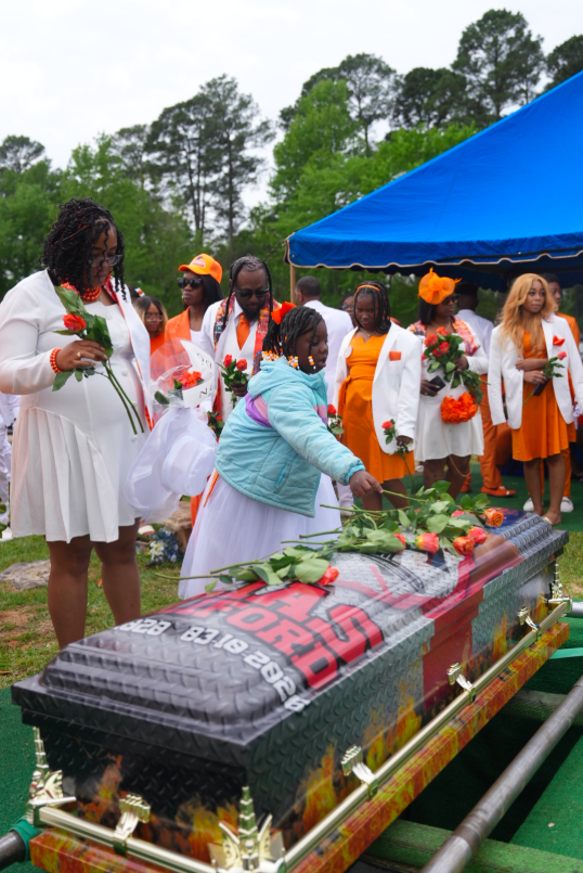 Loved ones in attendance at Elias Reliford's funeral. | Source: Facebook/Fam First