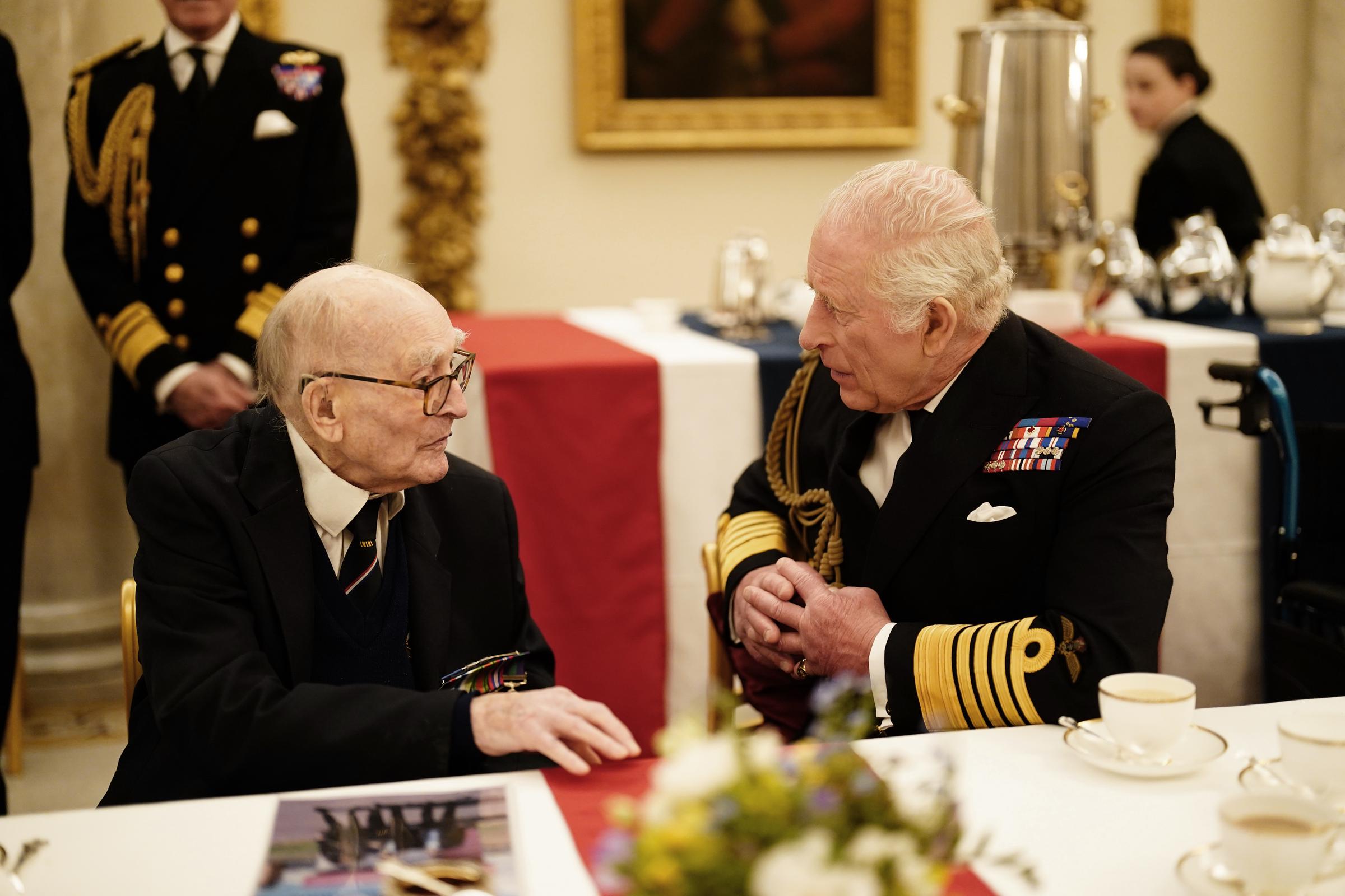 King Charles III joins Second World War veterans at a tea party in Buckingham Palace following the military procession to mark the 80th anniversary of VE Day in London, England, on May 5, 2025 | Source: Getty Images