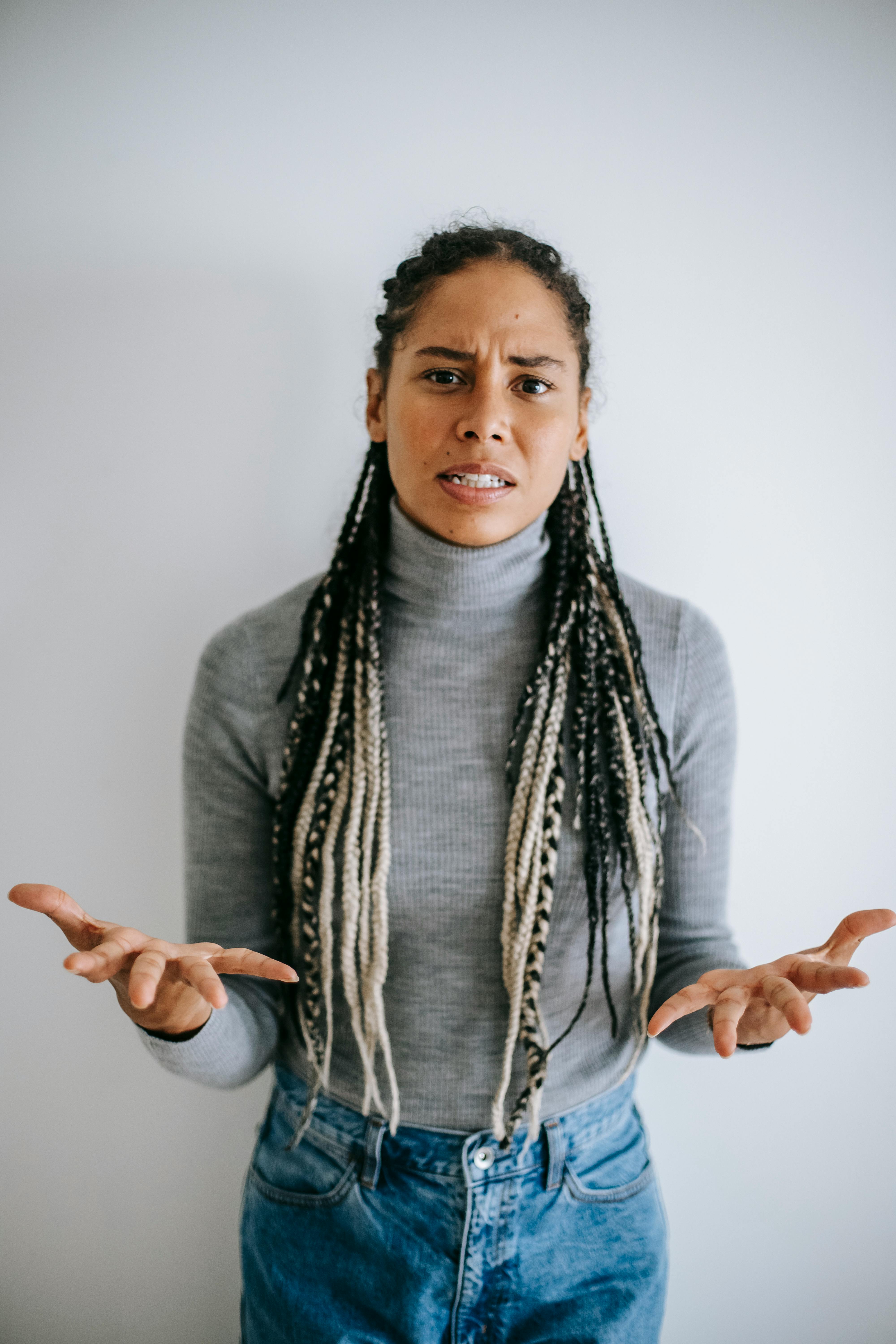 A shocked black woman | Source: Pexels