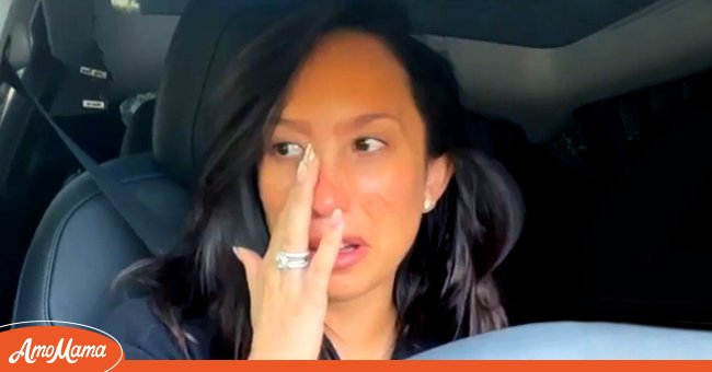 A picture of professional dancer Cheryl Burke crying in her car | Photo: Instagram/cherylburke