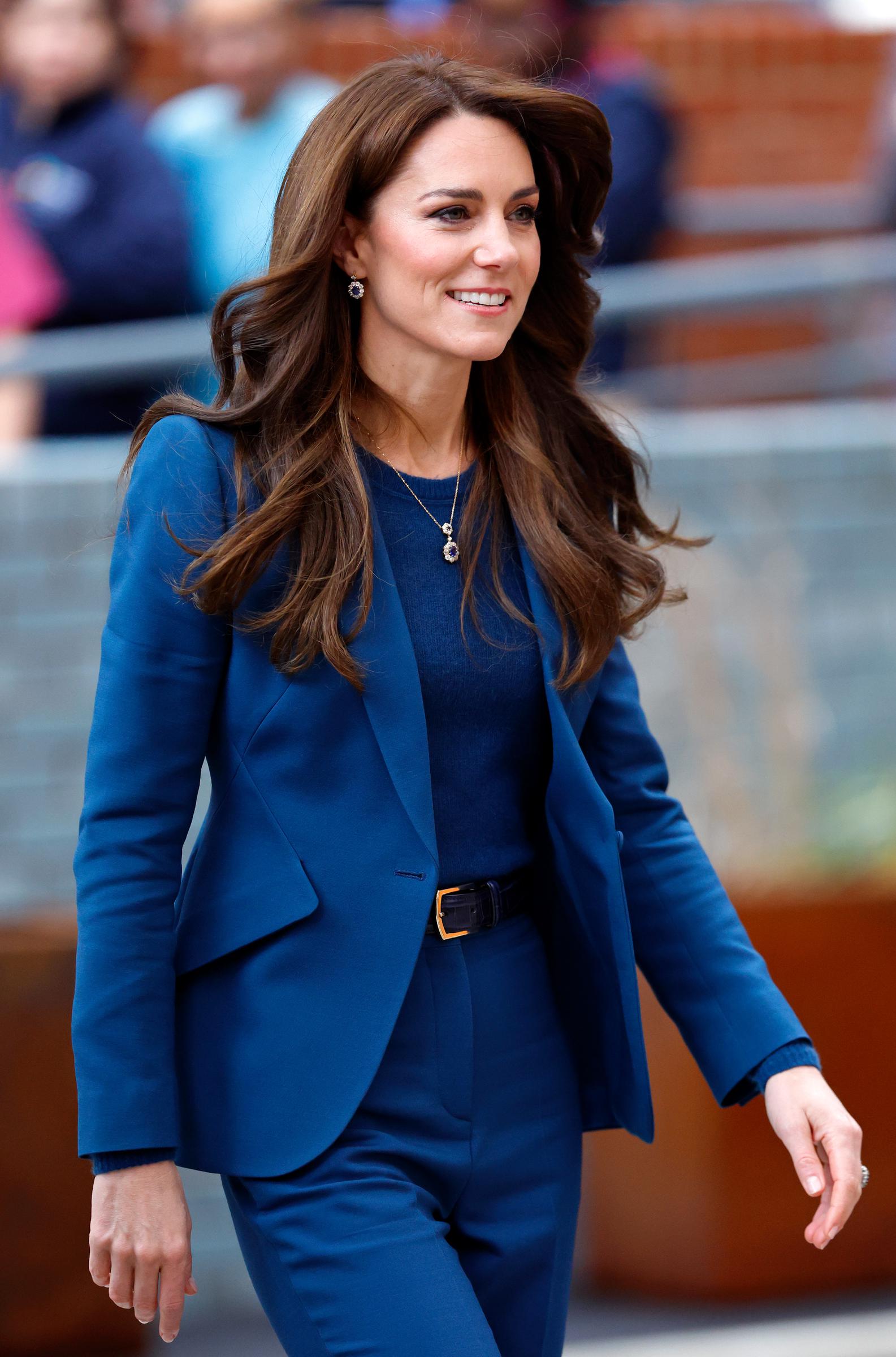 Catherine, Princess of Wales, attends the opening of Evelina London's new children’s day surgery unit. Wearing a royal blue suit, she completed her look with neatly styled hair, reflecting her signature polished appearance for the official engagement.