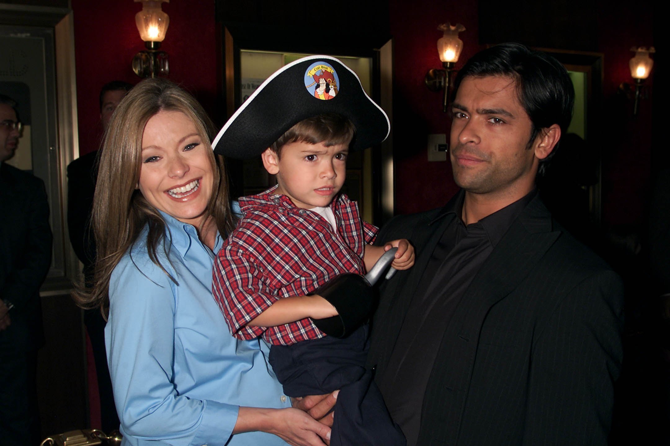 Kelly Ripa and Mark Consuelos with their older son Michael. I Image: Getty Images.