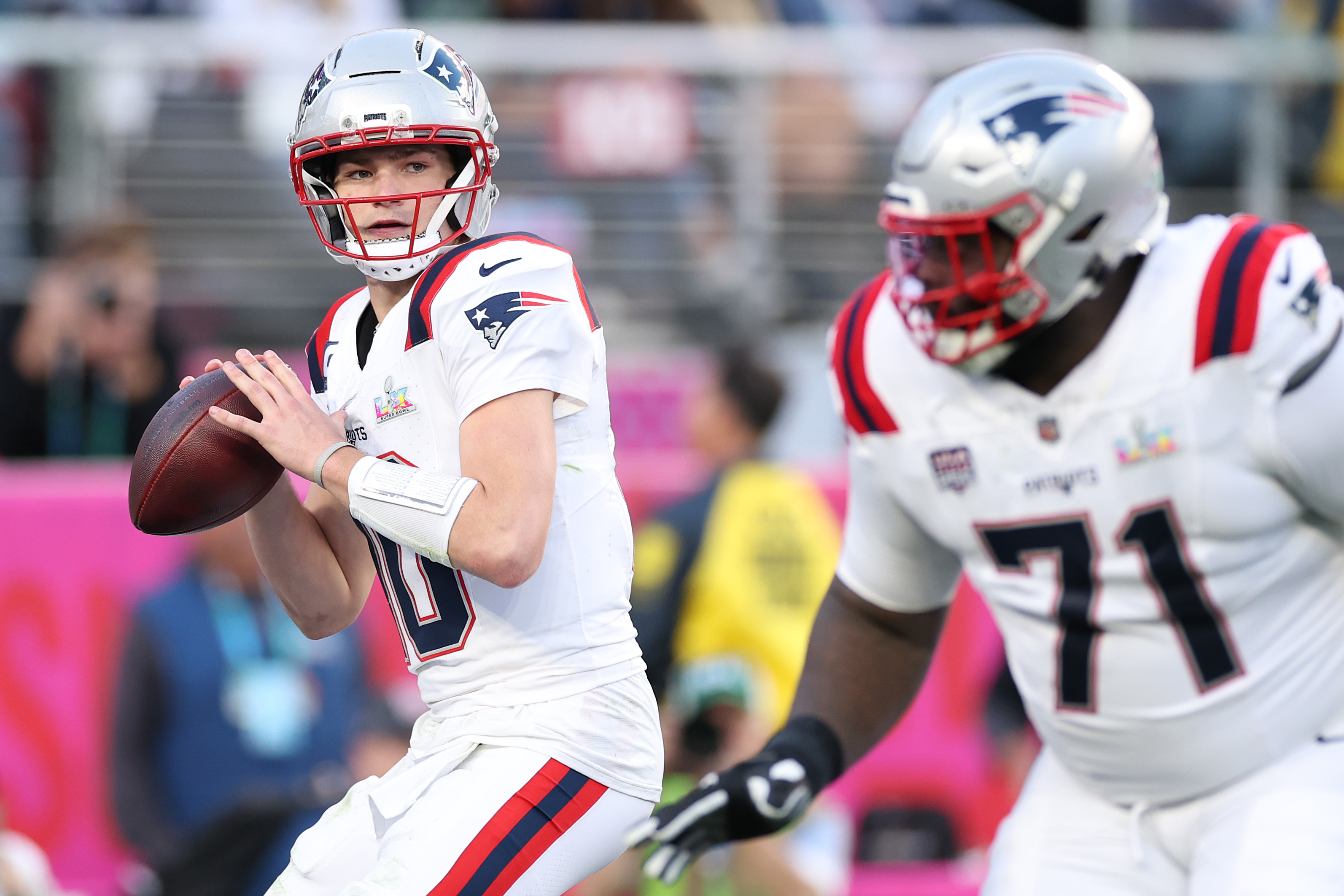 New England Patriots quarterback Drake Maye looks to pass against the Seattle Seahawks. | Source: Getty Images
