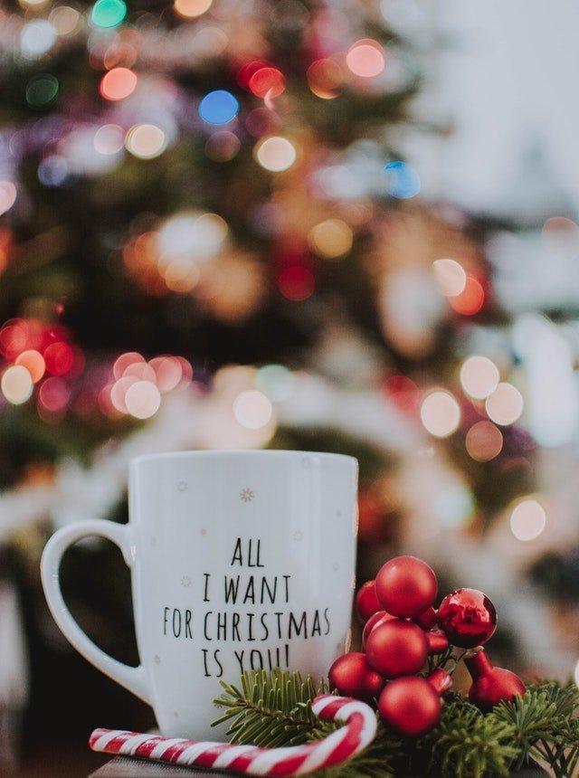 "All I want for Christmas is you" mug with candy | Source: Pexels 
