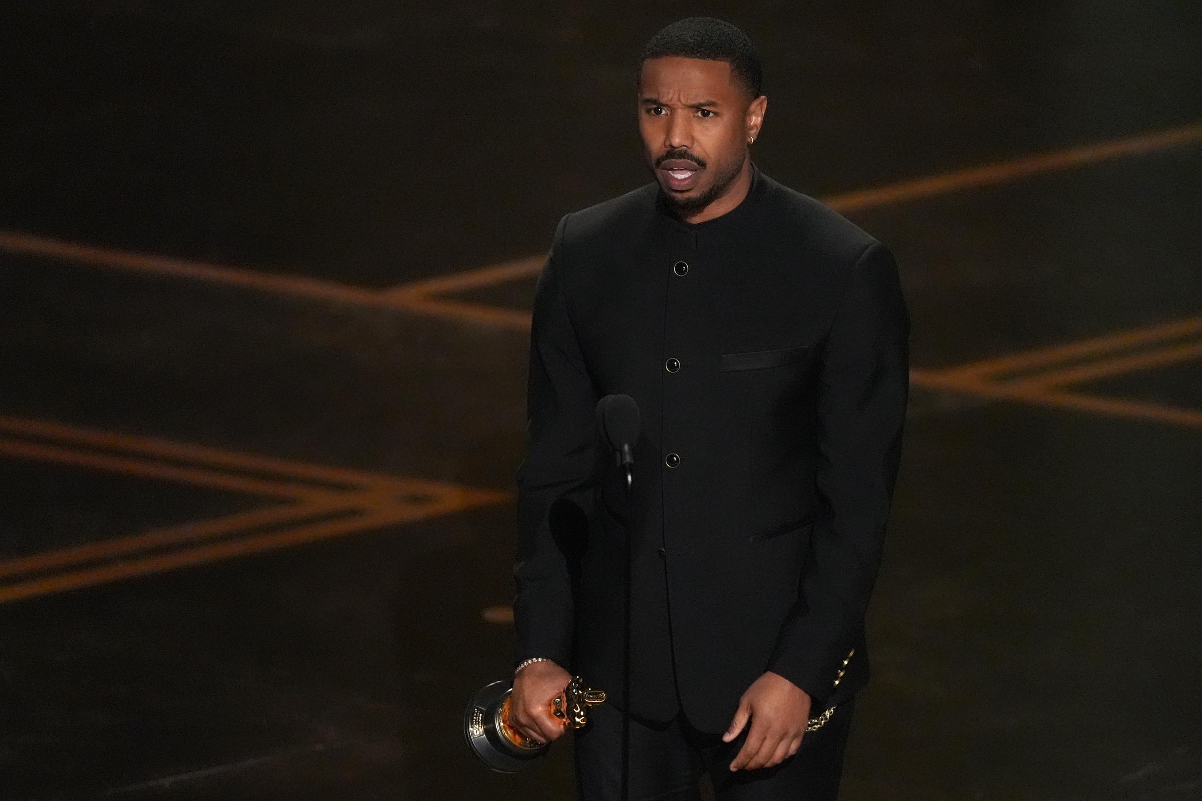 Michael B. Jordan accepts the award for actor in a leading role for "Sinners" | Source: Getty Images