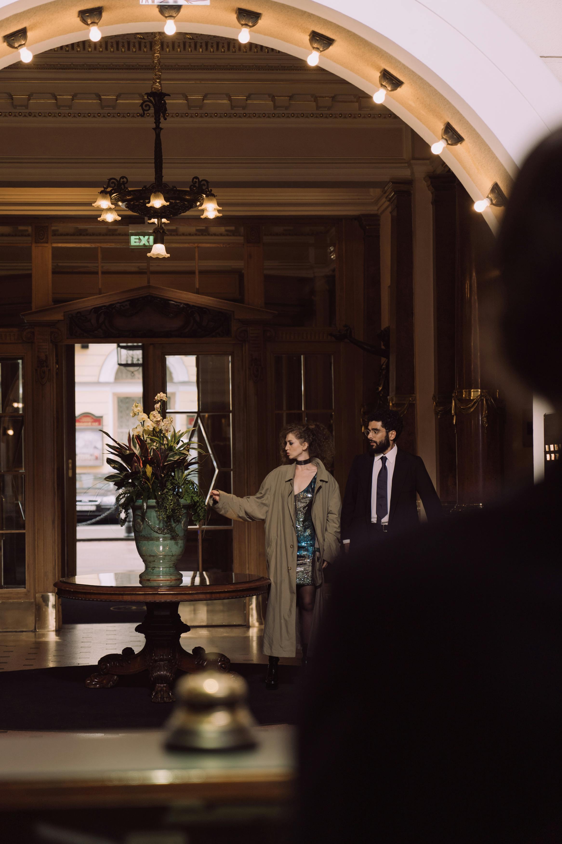 Man and woman standing in a hotel lobby | Source: Pexels