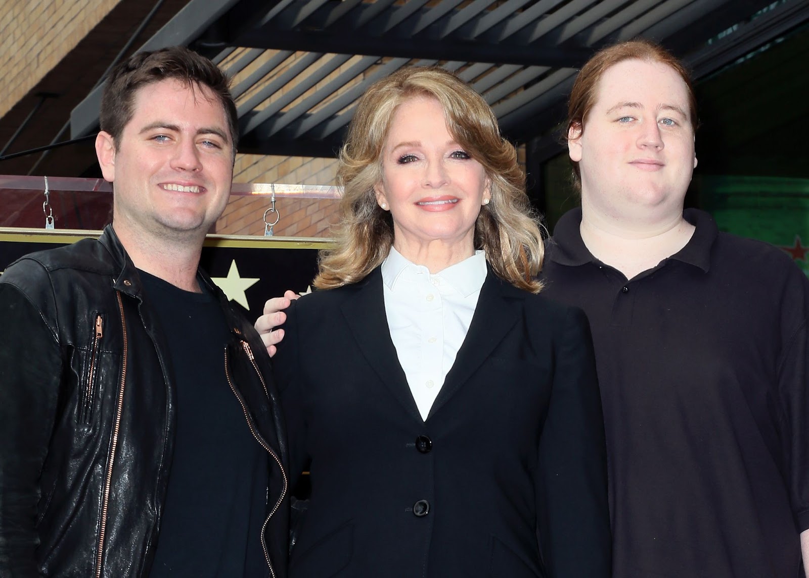 Deidre Hall with her sons David Atticus Sohmer and Tully Chapin at her ceremony being honored with a Star on the Hollywood Walk of Fame on May 19, 2016, in Hollywood, California. | Source: Getty Images