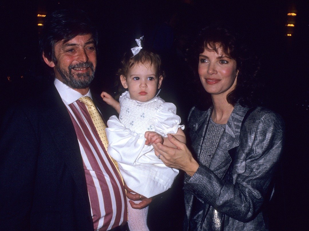Actress Jaclyn Smith, husband Anthony Richmond and their daughter Spencer at the Young Musicians Foundation's Sixth Annual Celebrity Mother-Daughter Fashion Show on March 26, 1987 at the Beverly Hilton Hotel in Beverly Hills, California. | Source: Getty Images