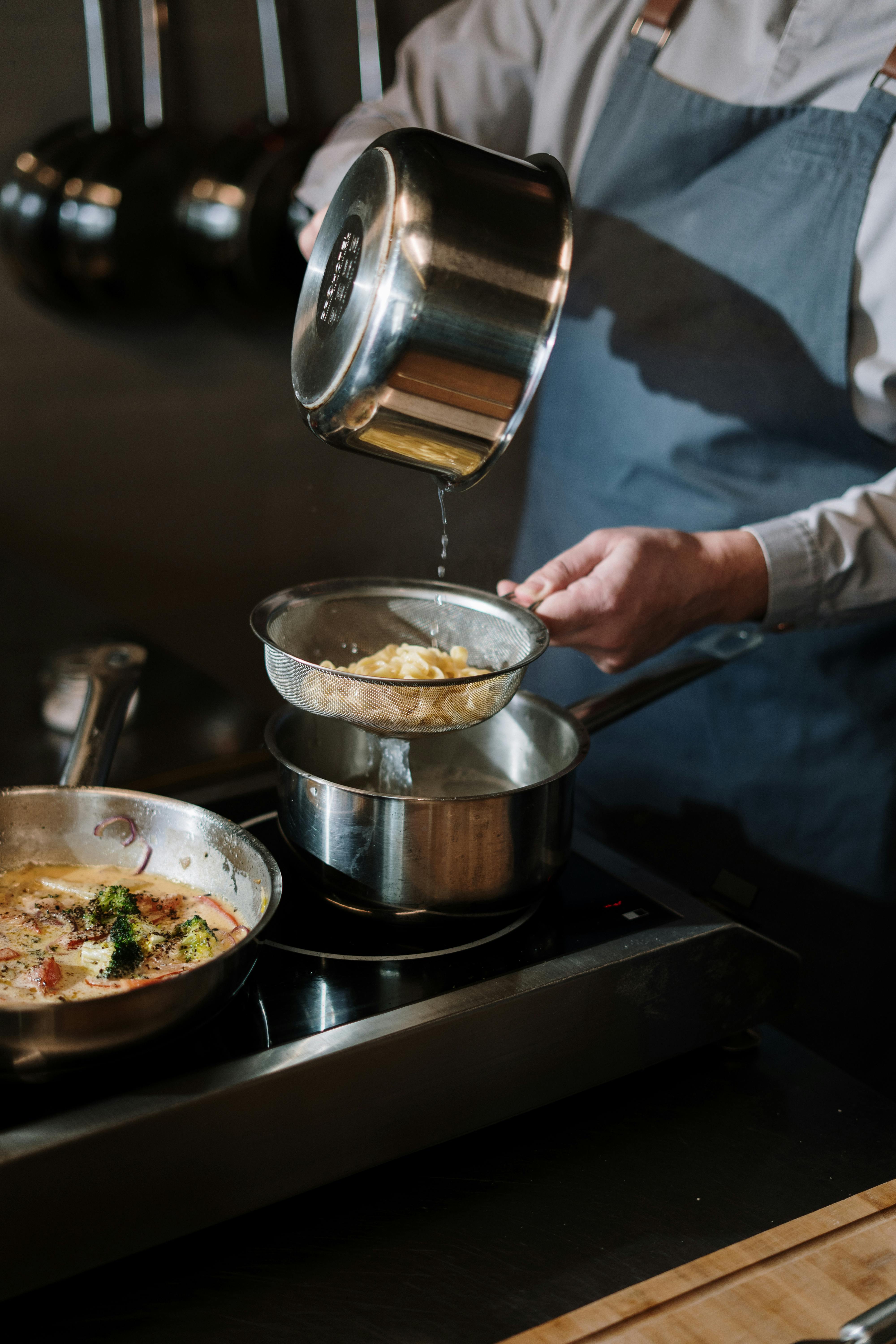 A person holding a cooking pot | Source: Pexels