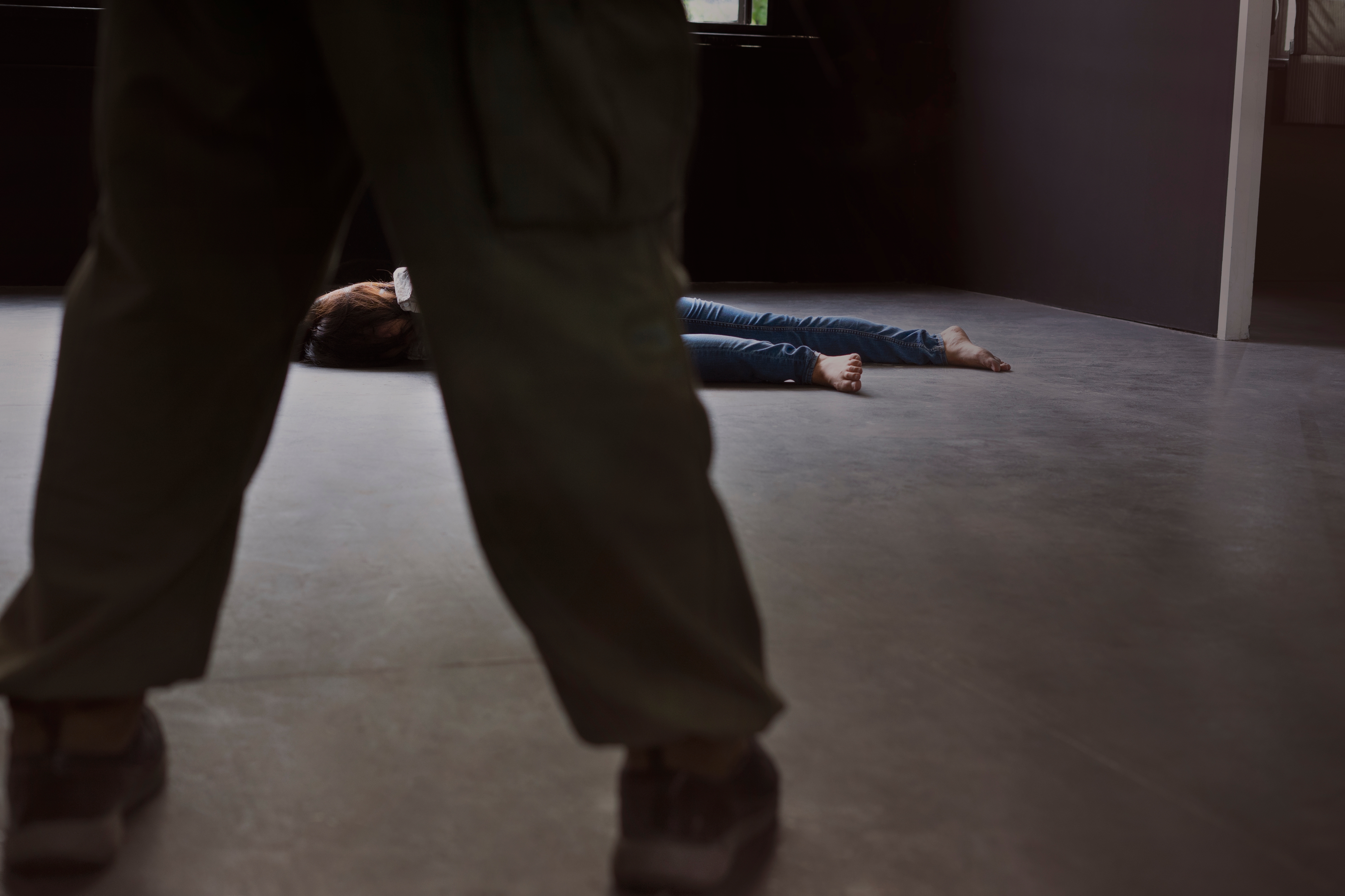 Unconscious woman on the ground | Source: Shutterstock.com