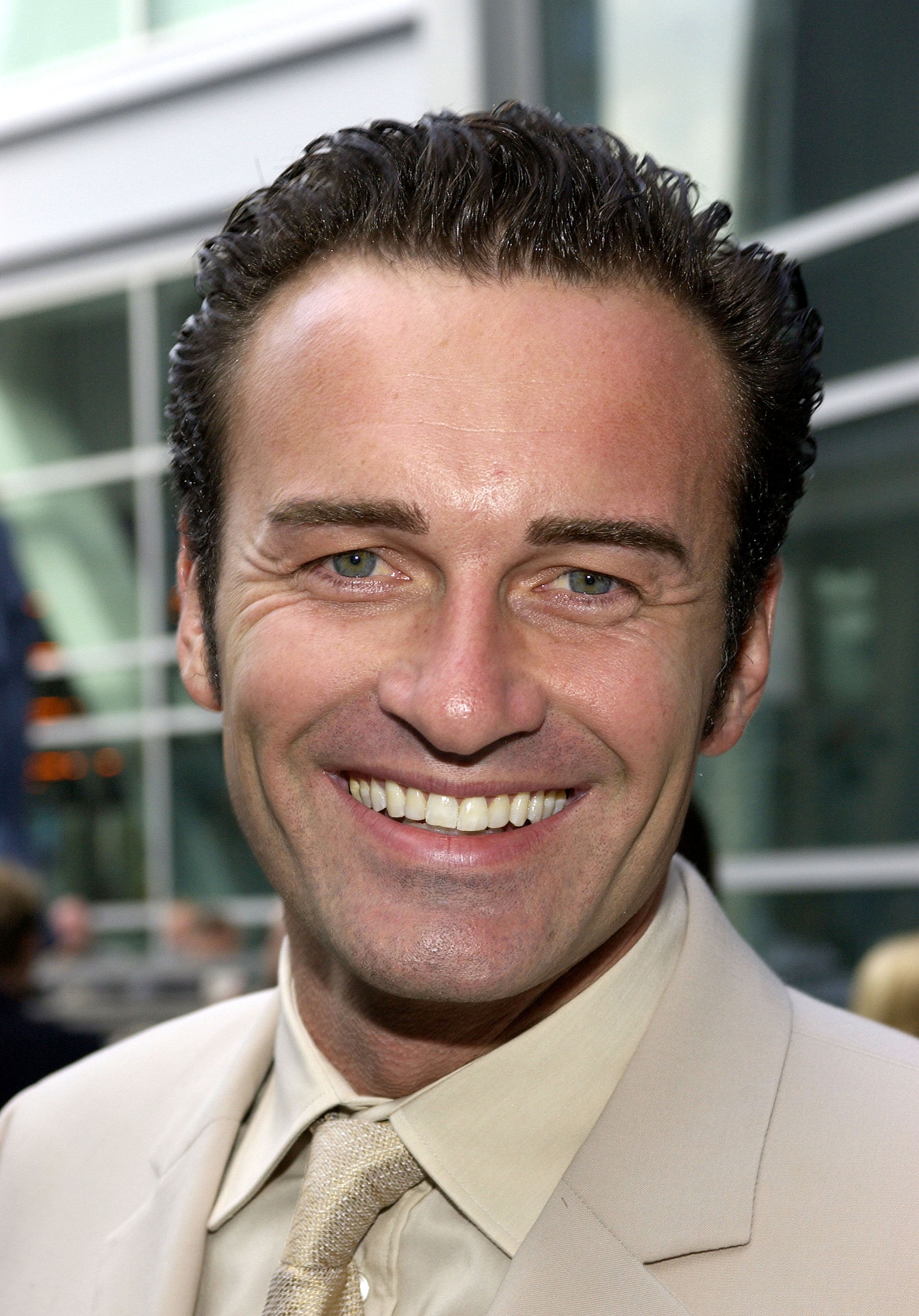 Julian McMahon attends a screening of the pilot episode of the FX original television drama series "Nip/Tuck" on July 19, 2003, at the Arclight Theatre in Hollywood, California | Source: Getty Images