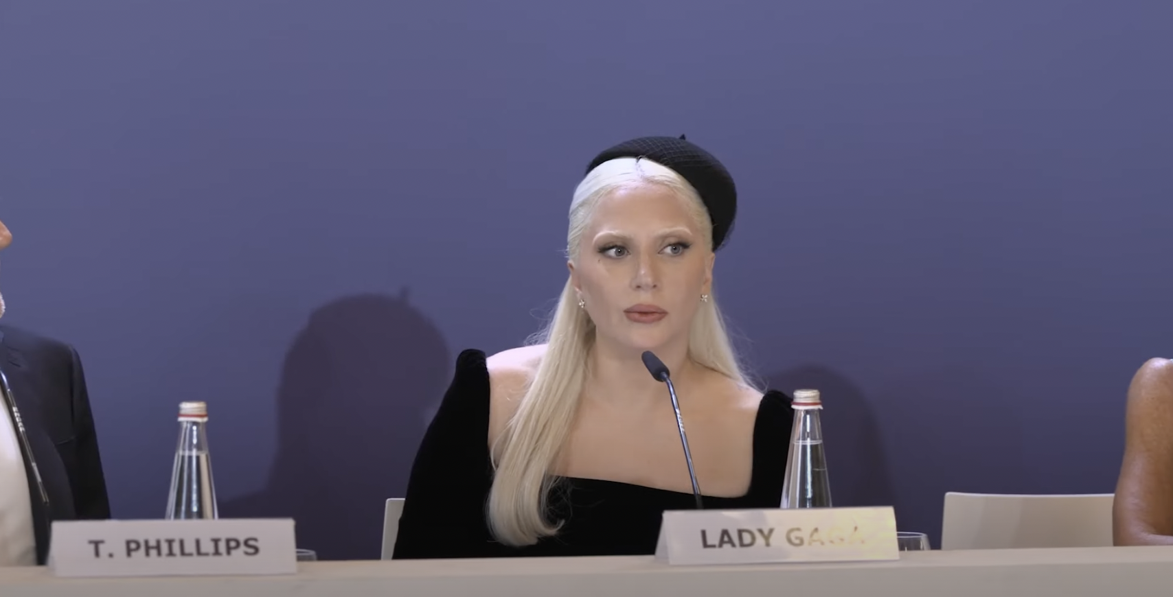 Lady Gaga reacts to Joaquin Phoenix praising her weight loss, during a Venice Film Festival press conference, from a YouTube video, dated September 4, 2024 | Source: Youtube/@pagesi