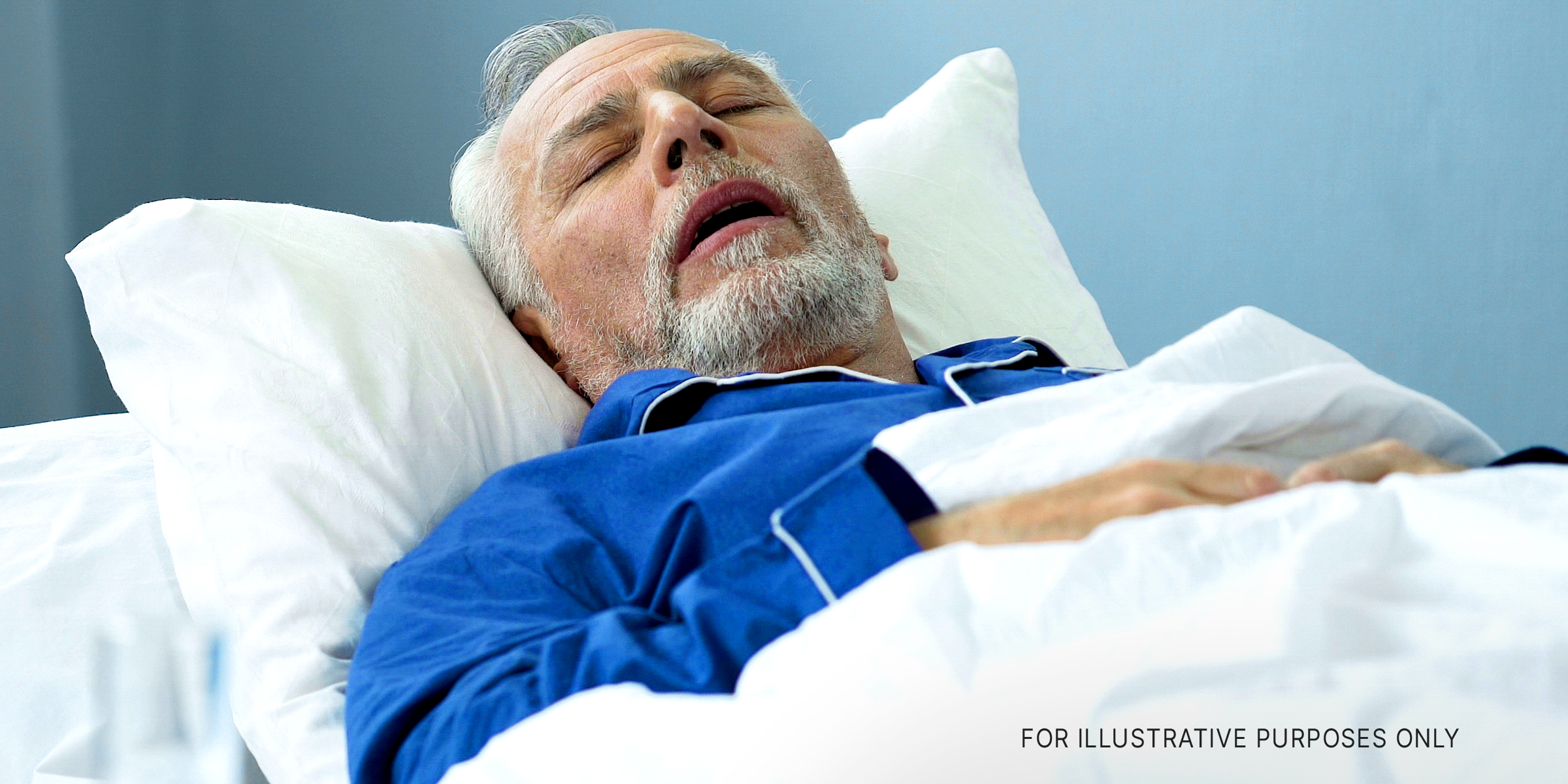 A man lying in bed with his eyes closed | Source: Shutterstock