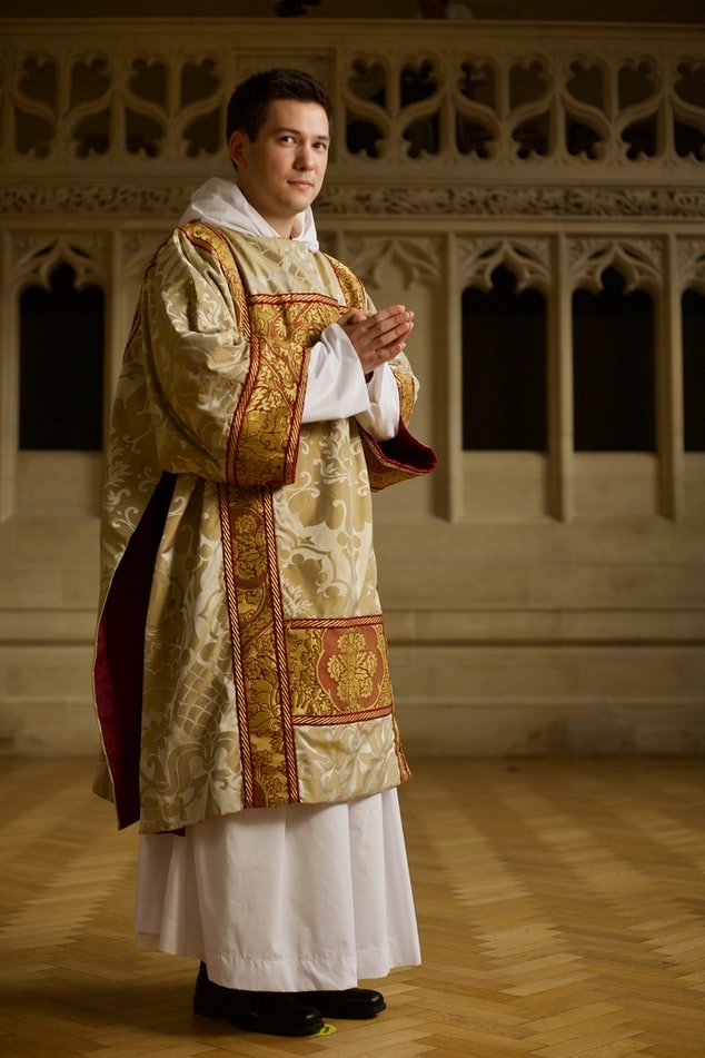 A portrait picture of a Parish priest. | Photo: Unsplash