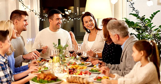 A photo of a family enjoying dinner. | Photo: Shutterstock