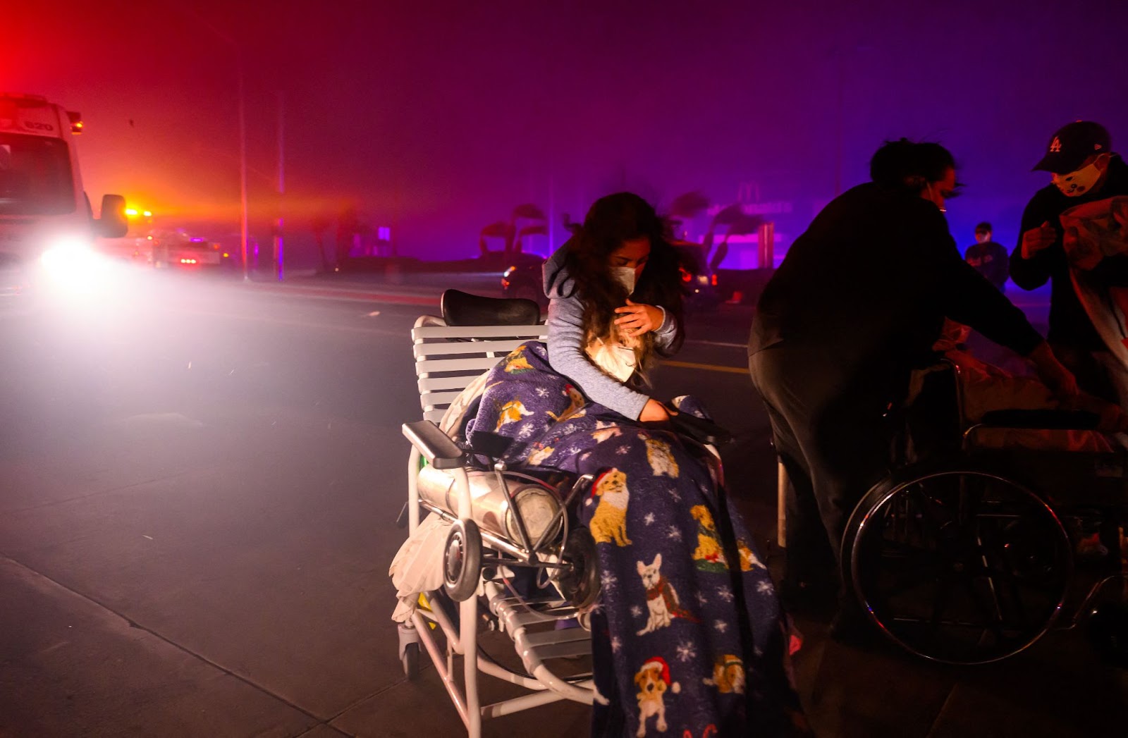 An elderly patient being evacuated into emergency vehicles during the Eaton fire in Pasadena, California, on January 7, 2025. | Source: Getty Images