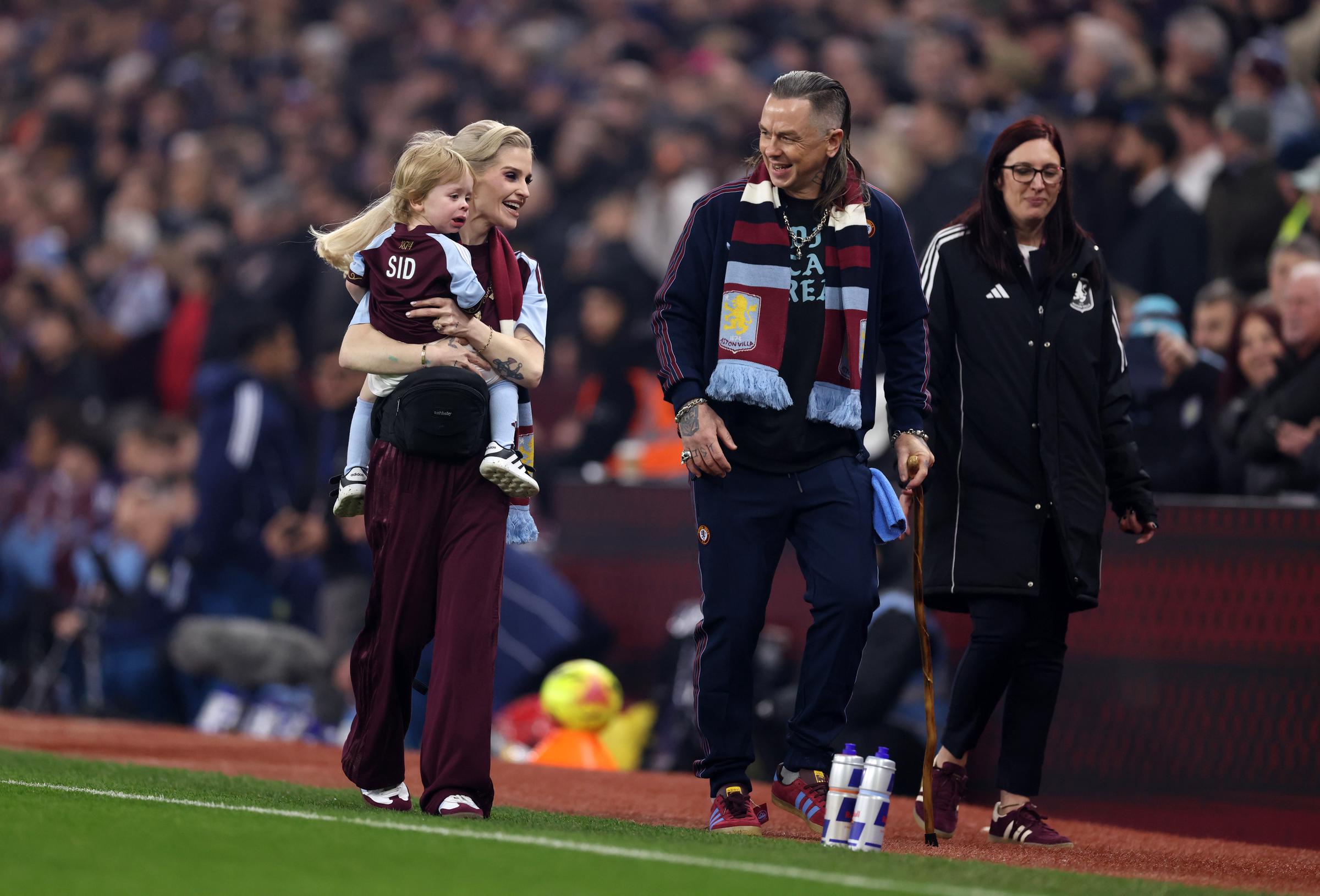 Kelly Osbourne is pictured with son Sidney and partner Sid Wilson ahead of the Premier League match between Aston Villa and Manchester United at Villa Park on 21 December 2025 in Birmingham, England. | Source: Getty Images