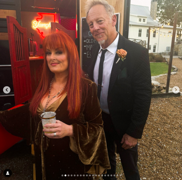 Wynonna Judd and Cactus Moser posing for a photo at Cactus' son's wedding, posted on January 4, 2025. | Source: Instagram/wynonnajudd