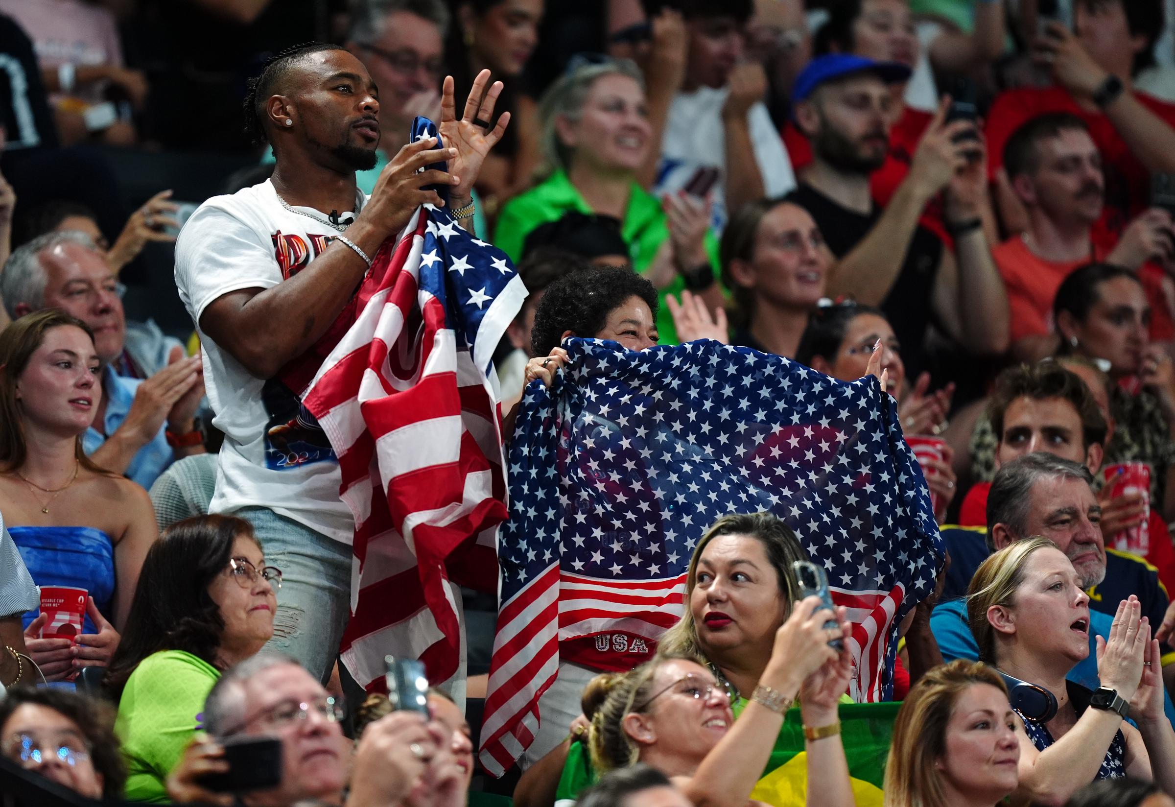 Jonathan Owens and Simone Biles' parents Nellie and Ronald Biles during the Artistic Gymnastics Women's Team Final at the Paris Olympic Games on July 30, 2024, in Paris, France | Source: Getty Images