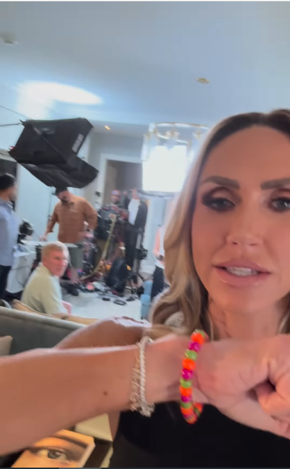 Lara Trump showing off her bracelet during a behind-the-scenes moment of her interview with the Chrisleys for "My View with Lara Trump," from a post dated June 23, 2025 | Source: Instagram/laraleatrump